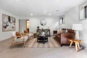 Living area featuring carpet, recessed lighting, and baseboards