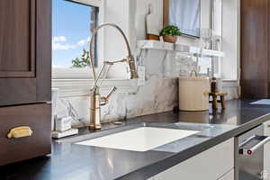 Detailed view of a sink and backsplash