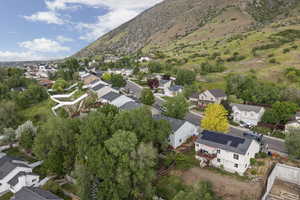 View of property location featuring nearby suburban area and a mountain backdrop