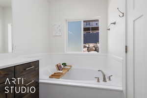 Bathroom with a garden tub and vanity