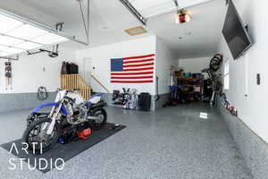 Garage featuring a garage door opener