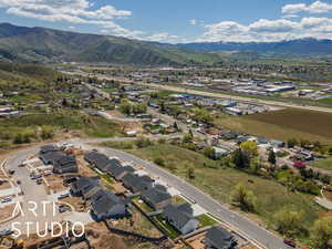 Aerial perspective of suburban area with a mountainous background