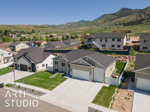 Aerial perspective of suburban area with a mountain backdrop