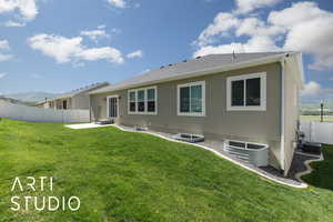 Back of property featuring a patio area and central AC