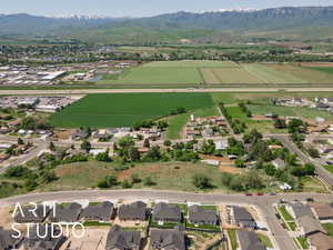 View of property location with mountains, large plots for crops, and rural landscape