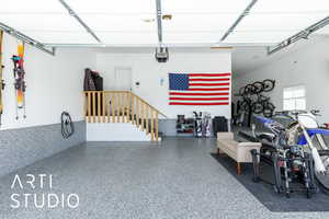 Garage featuring a garage door opener