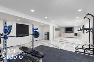 Workout area with recessed lighting and marble finish floors