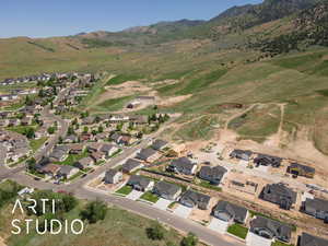 View of property location with mountains and nearby suburban area