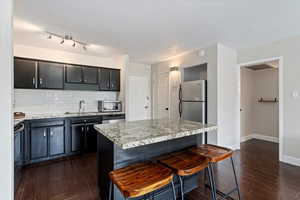 Kitchen featuring a large island that can double as a breakfast bar.