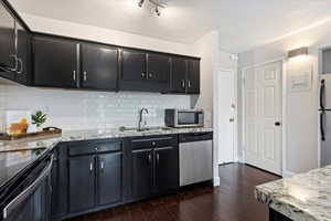 Kitchen and entry foyer with closet.