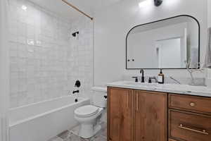 Full bath with toilet, shower / bath combination, and vanity