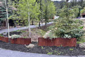 Steel planters: Engineered to modernize landscape, safeguard vehicles, and elevate curb appeal.