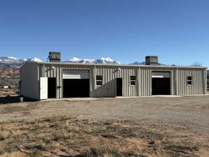 View of outbuilding with a mountain view
