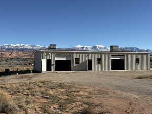View of outbuilding featuring a mountain view