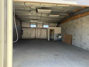 Garage featuring concrete block wall