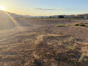 View of yard featuring a mountain view, a rural view, and an outbuilding