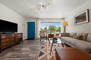 Living room with wood finished floors and baseboards