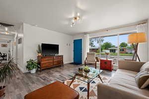 Living area featuring wood finished floors and baseboards