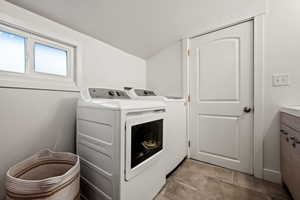 Laundry room featuring separate washer and dryer