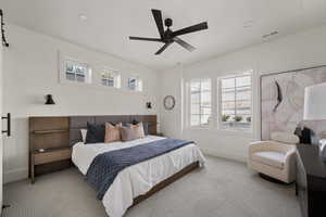 Carpeted bedroom with baseboards, ceiling fan, and recessed lighting