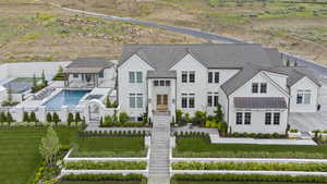 View of subject property featuring a pool