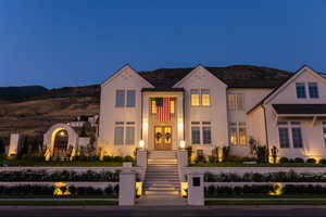 View of front of house featuring a mountain view and french doors