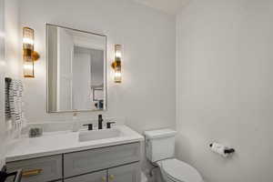 Bathroom with toilet and vanity