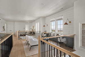 Living room featuring light wood-style floors and recessed lighting
