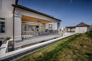 Rear view of house with a lawn
