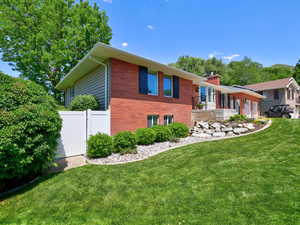 View of home's exterior featuring a garage and brick siding