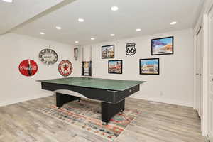 Recreation room with recessed lighting, light wood-style flooring, and baseboards