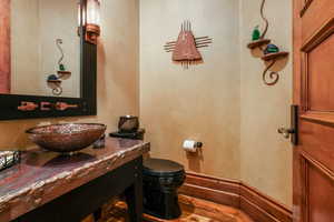 Half bath featuring vanity and toilet