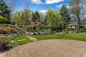 View of green lawn featuring stairway