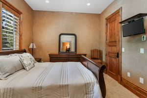 Bedroom with carpet floors and recessed lighting