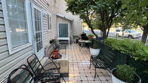 View of patio featuring fence