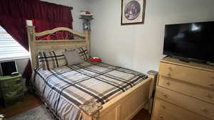 Bedroom with wood finished floors