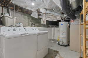 Clothes washing area with gas water heater and washing machine and clothes dryer
