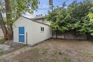 View of shed featuring a fenced backyard