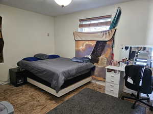 Bedroom featuring an office area