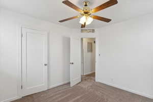 Unfurnished bedroom with carpet flooring, baseboards, and a ceiling fan