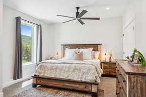 Bedroom with carpet, ceiling fan, and recessed lighting