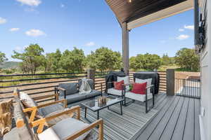 Wooden deck with outdoor lounge area and area for grilling