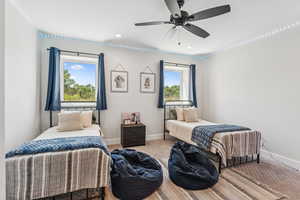 Carpeted bedroom with ceiling fan and recessed lighting