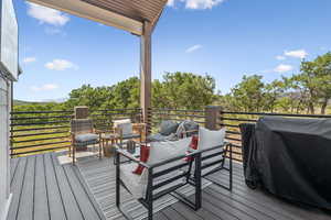 Wooden terrace featuring grilling area
