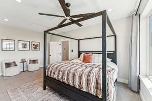 Carpeted bedroom featuring recessed lighting and ceiling fan
