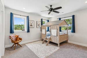 Carpeted bedroom with recessed lighting and ceiling fan