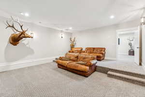 Living area featuring carpet and recessed lighting