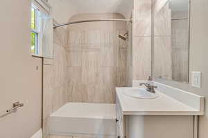 Full bath featuring vanity and tub / shower combination