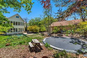 View of yard featuring a fire pit and a patio area
