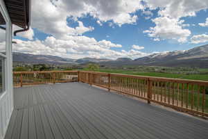 Wooden terrace featuring a mountain view